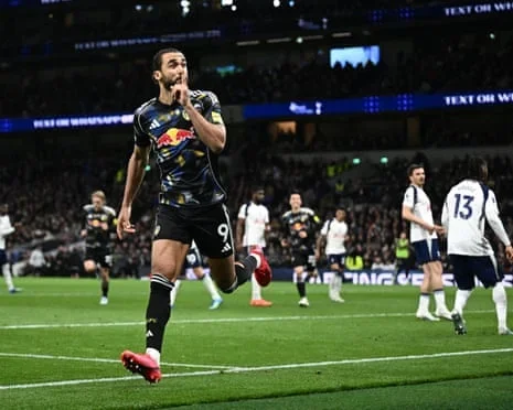 Dominic Calvert-Lewin races away in delight after scoring his penalty to deny Tottenham a precious victory