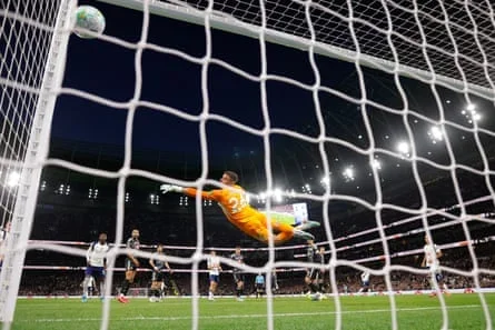 Mathys Tel places his shot past goalkeeper Karl Darlow for Tottenham’s breakthrough.